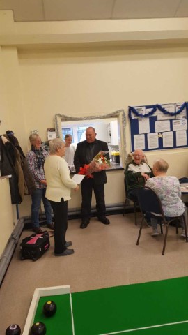 Cllr Margaret Walters receiving flowers