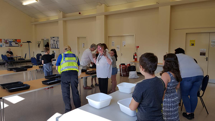 police and children making seed bombs