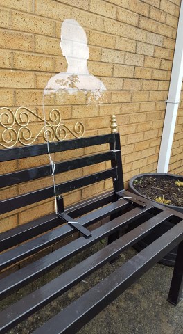 remembrance silhouette on a black bench