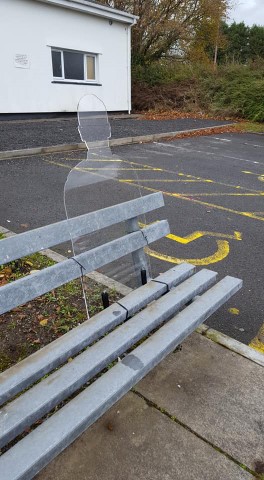 remembrance silhouette on a grey bench