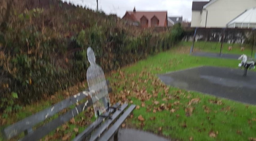 remembrance silhouette on a black bench