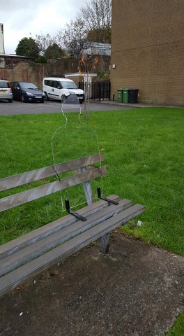 remembrance silhouette on a brown bench