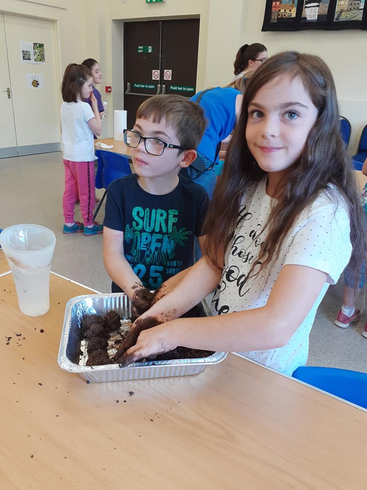 children making seed bombs